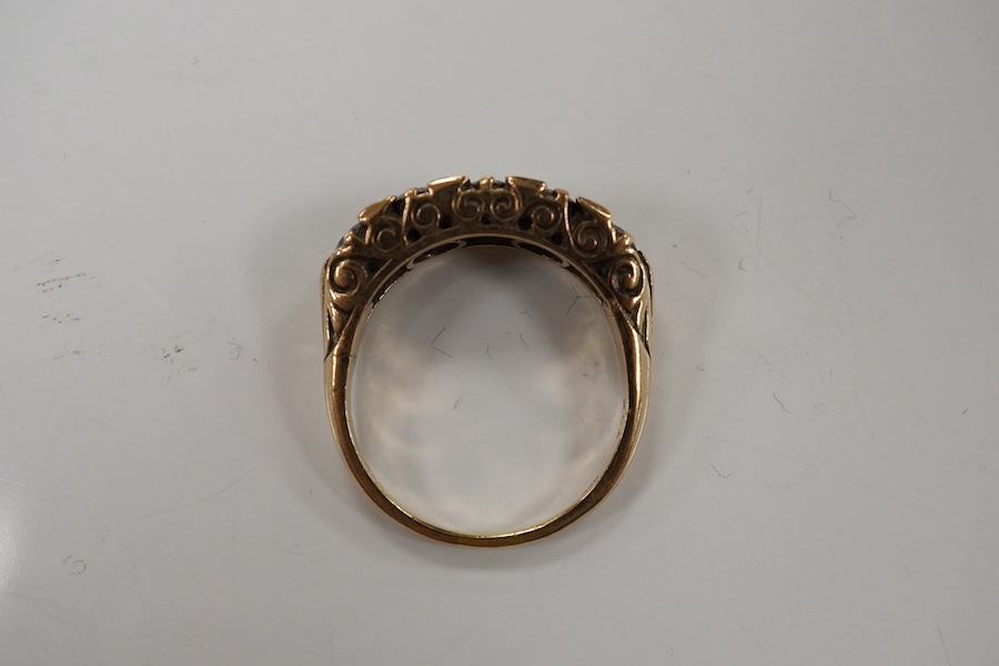 A 1970's Victorian style 9ct gold and graduated five stone sapphire set half hoop ring, size Q, gross weight 5.6 grams. Condition - fair to good